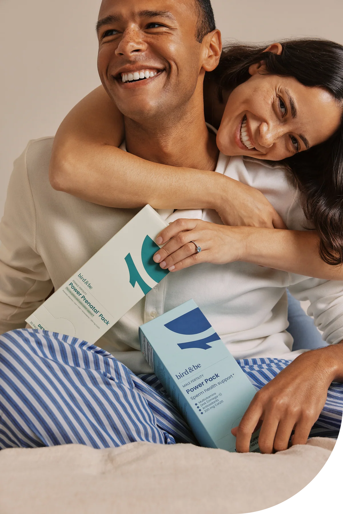 A couple holding the Female and Male Fertility Power Packs